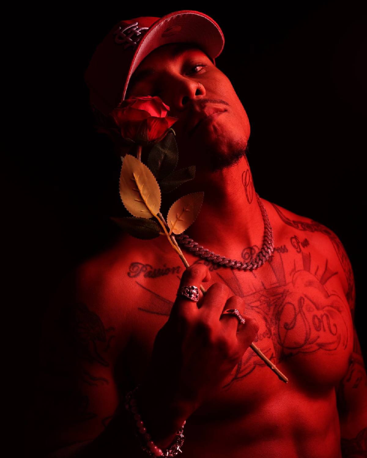 J-Keeth holding a rose